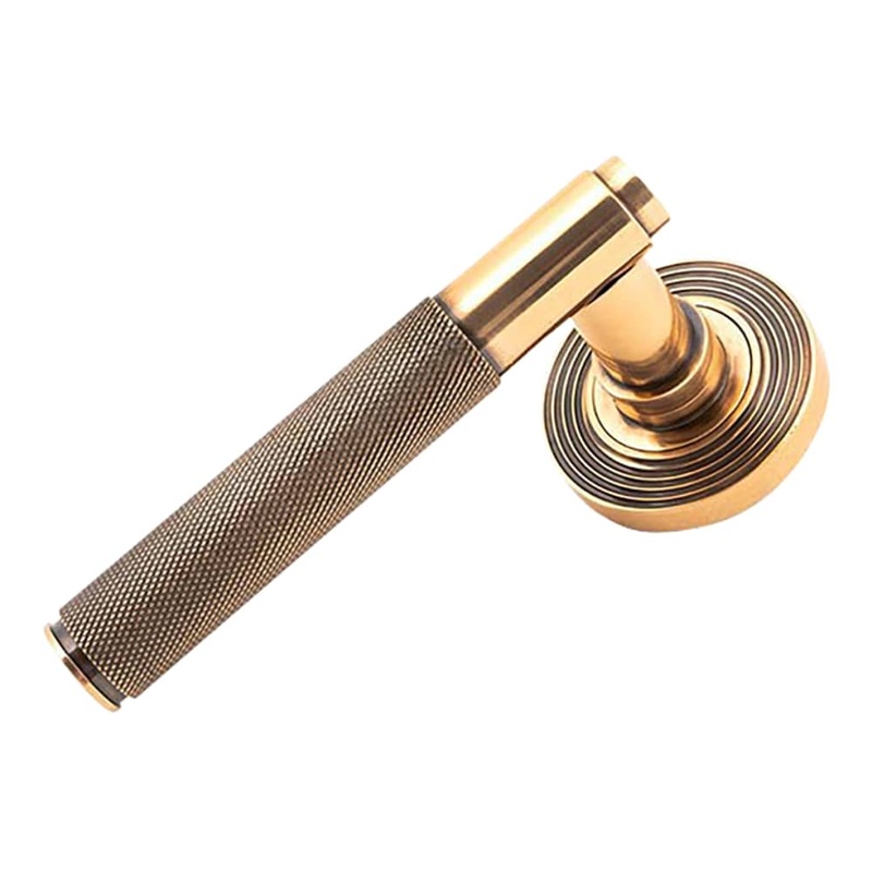 From The Anvil Brompton Knurled Door Handle on Reeded Beehive Rose – Polished Bronze